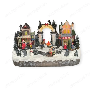 Karácsonyi falu, jelenet boltokkal, gyerekekkel, Mikulással fény és mozgás funkcióval, 33 18 19 cm